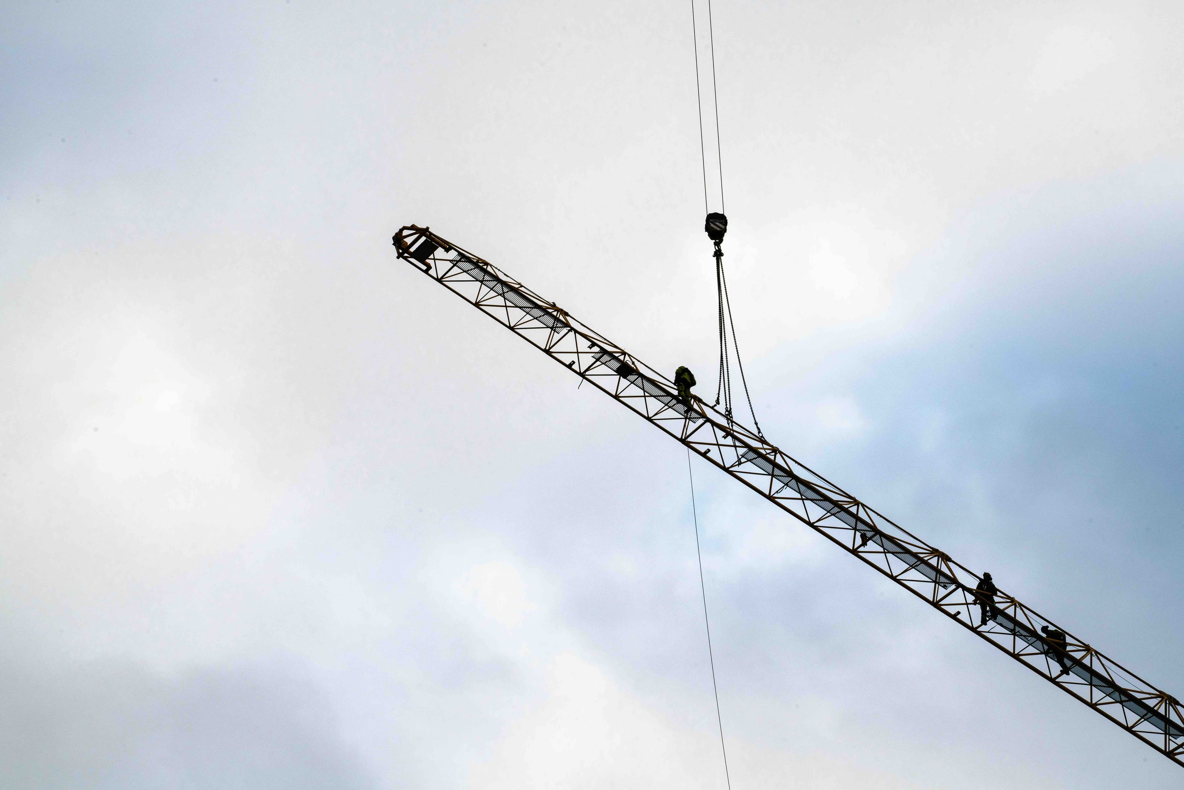 Rope access technicians cleaning high-rise windows